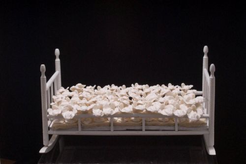 She Cradle, 2006 — Antique wood, rubber vulval castings, fabric — Shirley Klinghoffer